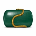 Macro view of dark green PU leather clutch with detailed golden snake metal ornament - Green
