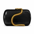 Detail view of black glossy PU clutch bag featuring an intricate golden snake sculpture - Black