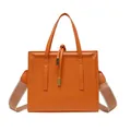 Fashionable square orange leather crossbody bag with broad strap and relief frame detail - Orange