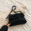 Black bow shoulder bag with pleated texture and heart-patterned silk scarf accessory - Versatile Black