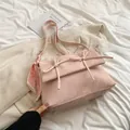 Pink bow shoulder bag with marble pattern and silk scarf on a soft white bed sheet - Ballet Powder