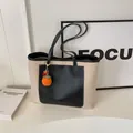 Beige canvas and black leather tote bag with orange fruit charm and shoulder strap - With Charm / Black