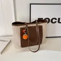 Canvas and brown leather tote bag featuring a bright orange crochet charm for women - No Pendant / Brown