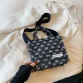 Black and white checkerboard denim tote bag with frayed edges and wide shoulder strap - Black