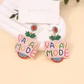 Detail of Vacay Mode beaded drop earrings with colorful bohemian fringe and studs - Vacay Mode Letters (VACAY MODE) / Red and Blue