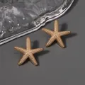 Chic golden starfish stud earrings with matte texture and zircon for beach vacations - Earthy Yellow