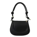 Minimalist black matte shoulder bag featuring knotted straps and gold hardware - Black