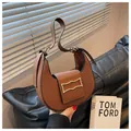 Minimalist dark brown crescent shoulder bag with golden metal buckle and leather strap - Coffee