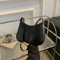 Minimalist black crescent moon armpit bag in smooth PU leather with slim shoulder strap - Black