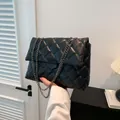 Chic black quilted crossbody bag with gunmetal chain strap and square flap closure - Black