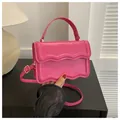 Minimalist square crossbody bag in bright fuchsia PU leather with scalloped flap design - Rose Red