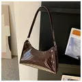 Minimalist glossy dark brown shoulder bag with V-shaped quilting and gold metal zipper - Dark Brown
