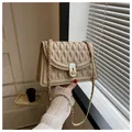 Elegant apricot quilted crossbody bag with gold chain strap and metal turn-lock closure - Khaki