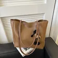 Brown faux leather tote bag with white stitching and a cute sheep plush charm detail - Coffee With Pendant