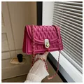 Elegant fuchsia quilted leather crossbody bag with chain strap and metal turn-lock closure - Rose Red