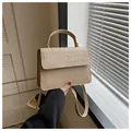 Creamy white crocodile pattern crossbody bag with gold rivet trim and single handle - Khaki