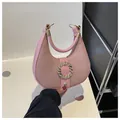 Pink hobo handbag with a minimalist half-moon shape and golden round buckle - Dusty Pink
