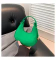 Bright green baguette bag with crocodile texture and golden metal buckle details - Green
