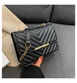 Classic black quilted crossbody bag with gold chain strap and elegant V-shaped stitching - Black