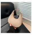 Chic beige crocodile pattern baguette bag with crescent shape and gold zipper detail - Khaki