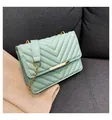 Mint green quilted crossbody bag with V-shaped stitching and golden metal chain strap - Green