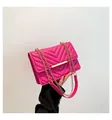 Elegant rose pink crossbody bag featuring V-shaped quilting and gold metal strap detail - Rose Red