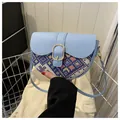 Ethnic style crossbody saddle bag in light blue with geometric patterns and gold buckle - Blue