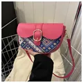 Ethnic style pink saddle bag with blue geometric woven pattern and gold buckle - Red