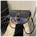Ethnic style crossbody saddle bag with geometric jacquard and black leather flap - Black