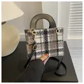 Elegant black and white houndstooth tweed square bag with golden hardware and black strap - Black
