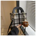 Houndstooth tweed handbag in black and white with brown plush monster charm and leather strap - Black With Pendant