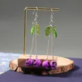 Unique cherry skull long drop earrings with green leaves and purple skull pendants - Purple