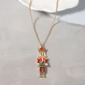 Detailed view of nutcracker soldier pendant with enamel finish and pearl accents - Red