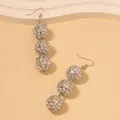 Detail of silver disco ball earrings with three mirror spheres on elegant hooks - Silver