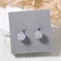 Silver disco ball earrings with mirrored square tiles on grey display card - Silver