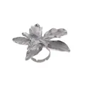 Macro detail of silver flower ring showing textured petals and adjustable open band - Silver