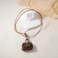 Mini leopard print suede bag pendant necklace with gold metal clasp on white stone base - Leopard Print Bag Pendant