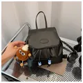 Mini black PU leather backpack for women with cute plush charm and fashion logo - With Plush Charm / Black