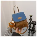 Mini vintage backpack in brown leather and blue denim with a plush monster charm - With Plush Charm / Blue and Brown