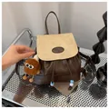 Vintage denim-style mini backpack in dark brown faux leather with tan textured flap - With Plush Charm / White & Coffee