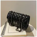 Classic black quilted chain shoulder bag with silver rotating lock for women - Black