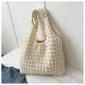 Chic beige ruched tote bag with popcorn texture and wide handle for everyday use - White