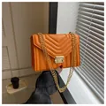 Quilted leather small square bag in vibrant orange with golden chain strap and buckle - Orange