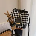 Chic houndstooth bucket bag with black leather trim and a cute plush rabbit charm - With Rabbit Pendant / Black