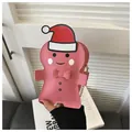 Pink gingerbread man crossbody bag with a red Santa hat and golden chain strap - Pink