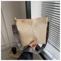 Chic beige faux leather tote bag with a colorful ethnic patterned shoulder strap - Khaki