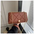 Elegant brown quilted crossbody bag with gold chain strap and rectangular metal buckle - Dark Brown