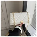 Elegant white quilted chain crossbody bag with gold-tone buckle for stylish women - White