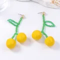 Handmade beaded cherry drop earrings with yellow resin fruits and green beaded leaves - Yellow