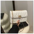 White heart quilted crossbody bag with gold heart lock and chain strap for women - White
